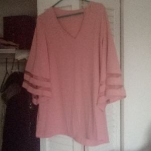 Soft pink loose blouse and 3/4 mesh sleeves.
